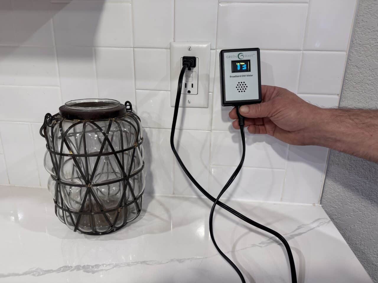 Greenwave Broadband EMI Meter plugged into an outlet