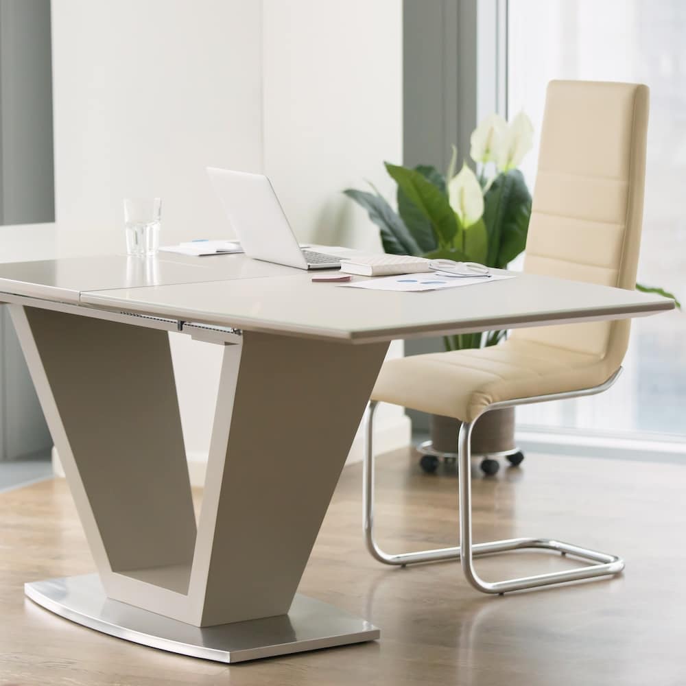 Office Kits Cover Image Photo of modern desk and chair next to large windows in a corner office full of natural light