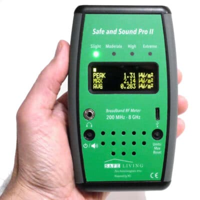 IMAGE - Safe and Sound Pro II RF Meter 2024 Model v2 - Greenwave Dirty Electricity Solutions Photo of the front of a Safe and Sound Pro II RF Meter. The meter is being held in a person's had
